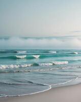 A beach with waves and fog in the distance photo