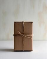 A brown box with a string tied around it photo