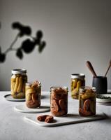 Pickled peppers and sausage in jars photo