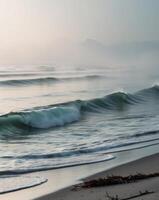 A person is standing on the beach with a surfboard photo