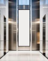 Spacious elevator lobby with blank vertical poster frame and illuminated surroundings in a modern building photo
