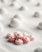 Peppermint Candies in a Festive Snowy Setting photo