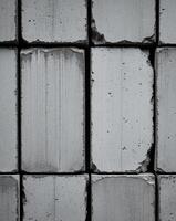Rough concrete block texture with visible seams and imperfections photo