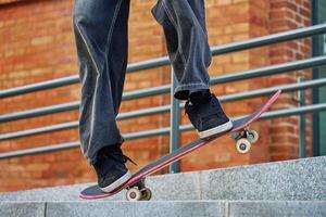 Skateboarder Performing Trick on Urban Street photo