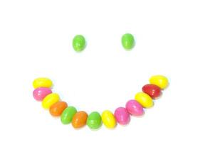 A smiley face made of colorful candy photo