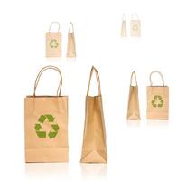 Paper bags with recycling symbol isolated on white background photo