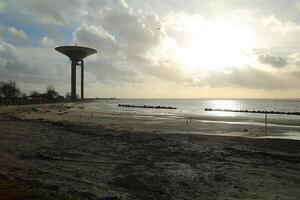 View on beach and new water tower in Landskron, Scania, Sweden photo