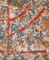Close up of the Scandinavian rune Fe from an ancient runestone photo