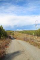 Road besides railroad track in Lapland, Sweden photo