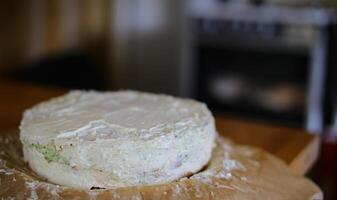 Preparation of Smorgastarta, a typical Swedish dish, in front of blurred kitchen stove photo