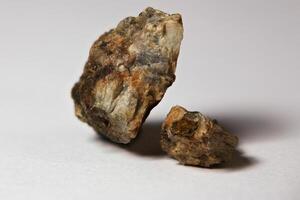 Two rocks with traces of gold visible on the outside photo