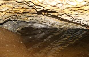 Lake and reflections inside Marmorgrottan the marble cave in Norway photo