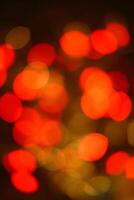 Blurred red and yellow lights with slightly oval shape photo