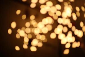 Blurred warm white lights with slightly oval shape photo