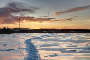HDR shot of winter dusk in Swedish Lapland, with breakable crust on the snow photo