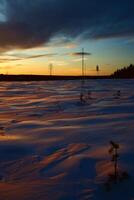 Winter sunset in Swedish Lapland, with breakable crust on the snow photo