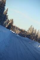 Tilted image of winter road in Sweden photo