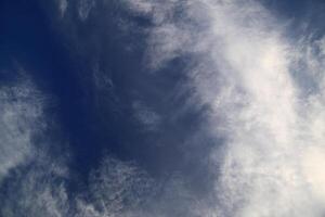Upward view into sky with various clouds photo