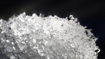 Close up of ice crystals in thawing snow photo