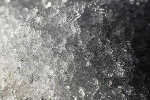 Close up of ice crystals in thawing snow photo