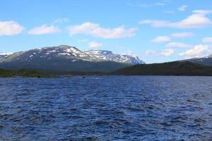 View to the mountains behind lake Tornetrask photo