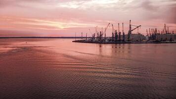 Industrial port in Rostock with cranes in dawn photo