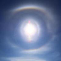 22 degree halo visible on a clear blue sky photo