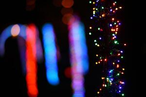 Abstract shot of string lights becoming blurry color spots photo