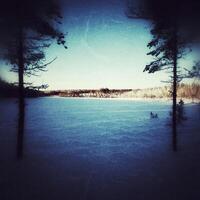 Grungy image of frozen lake Stor-Ockeltjarn in Lapland photo