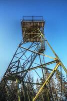 Upward view on old lookout tower in Sweden photo
