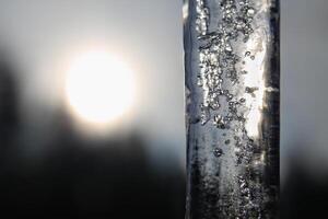 Close up of beautiful icicle in sunlight photo