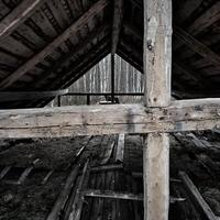 Weathered timber frame of an old barn photo