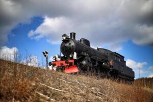 Old Swedish steam engine in western-like setting photo