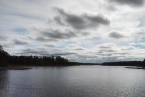 High contrast shot of Swedish lake and clouds photo