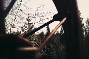 Grungy shot of rusty wheel at an abandoned mine photo