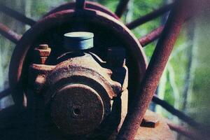 Grungy shot of rusty bearing at an abandoned mine photo