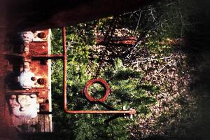 Grungy shot of rusty machinery at an abandoned mine photo