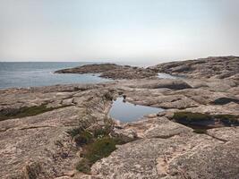 Coast of the island Hallon, a nature reserve near Smogen in Sweden photo