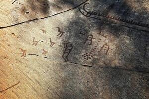 Rock painting at the World Heritage Site Tanum in Sweden photo
