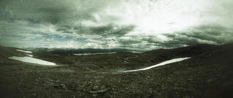 Grungy shot of barren landscape on northern Swedish mountains photo