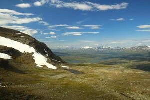 Lakes and snowy mountain in Swedish Lapland photo