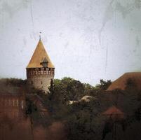 Grungy shot of medieval tower of Tangermunde city and castle photo