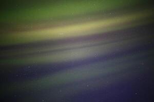 Soft northern light curtains in the sky photo