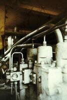 Grungy shot of an excavator hydraulic compressor unit photo