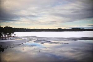 View over Lake Ektjarnen in northern Sweden photo