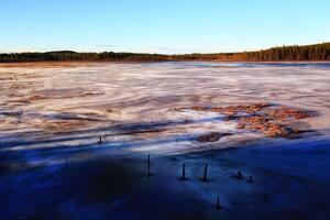 View over frozen Lake Fabodtrasket in northern Sweden photo
