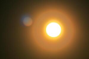 Abstract shot of radiant sun with lens flare photo