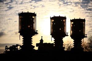 Abstract shot of vintage industrial device with valves and electrical components photo