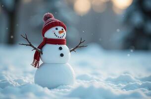 Snowman sightly in hat and scarf standing in snow against the background of forest in winter, free space for text photo