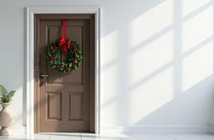 Front door decorated Christmas amazing tree branches and mistletoe, white wall and background, free space for text photo